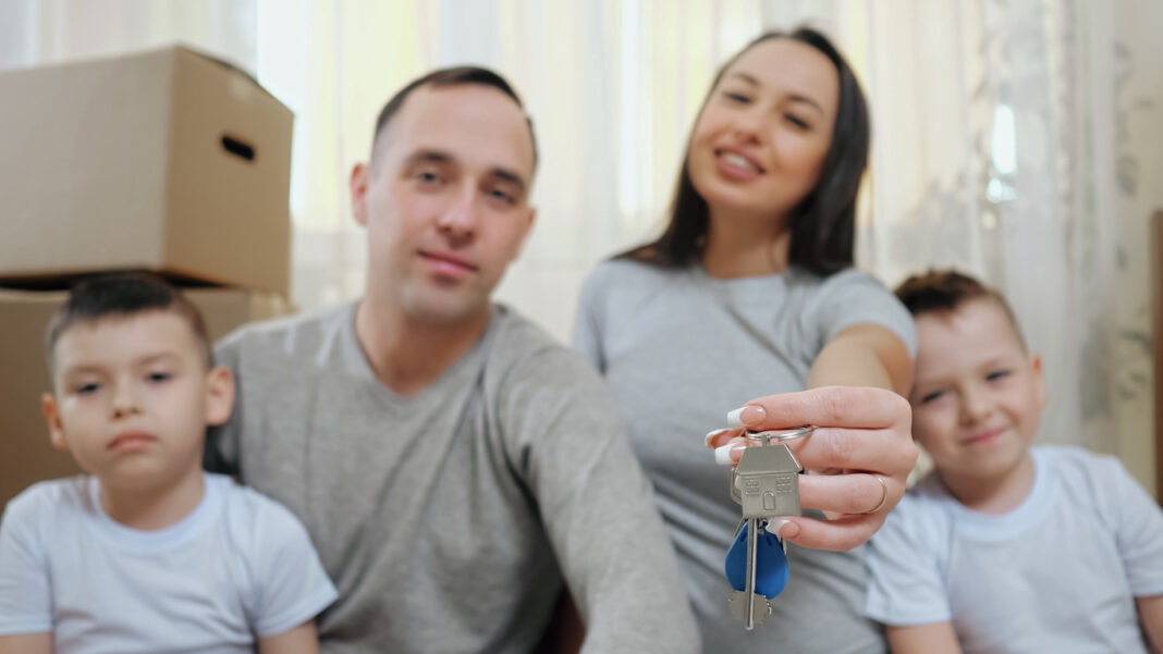Amused family enjoys moving into new apartment together