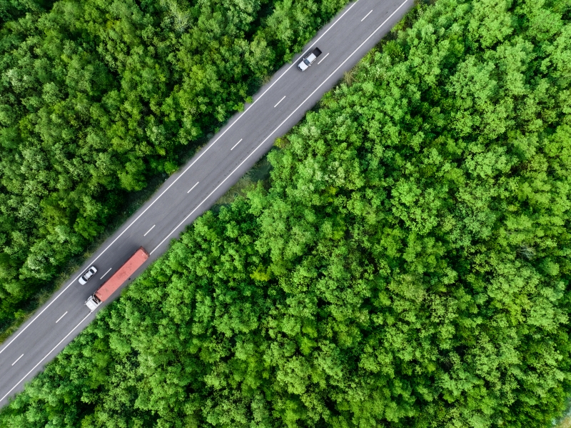 aerial-top-view-of-car-and-truck-driving-on-highwa-2023-11-27-05-25-21-utc